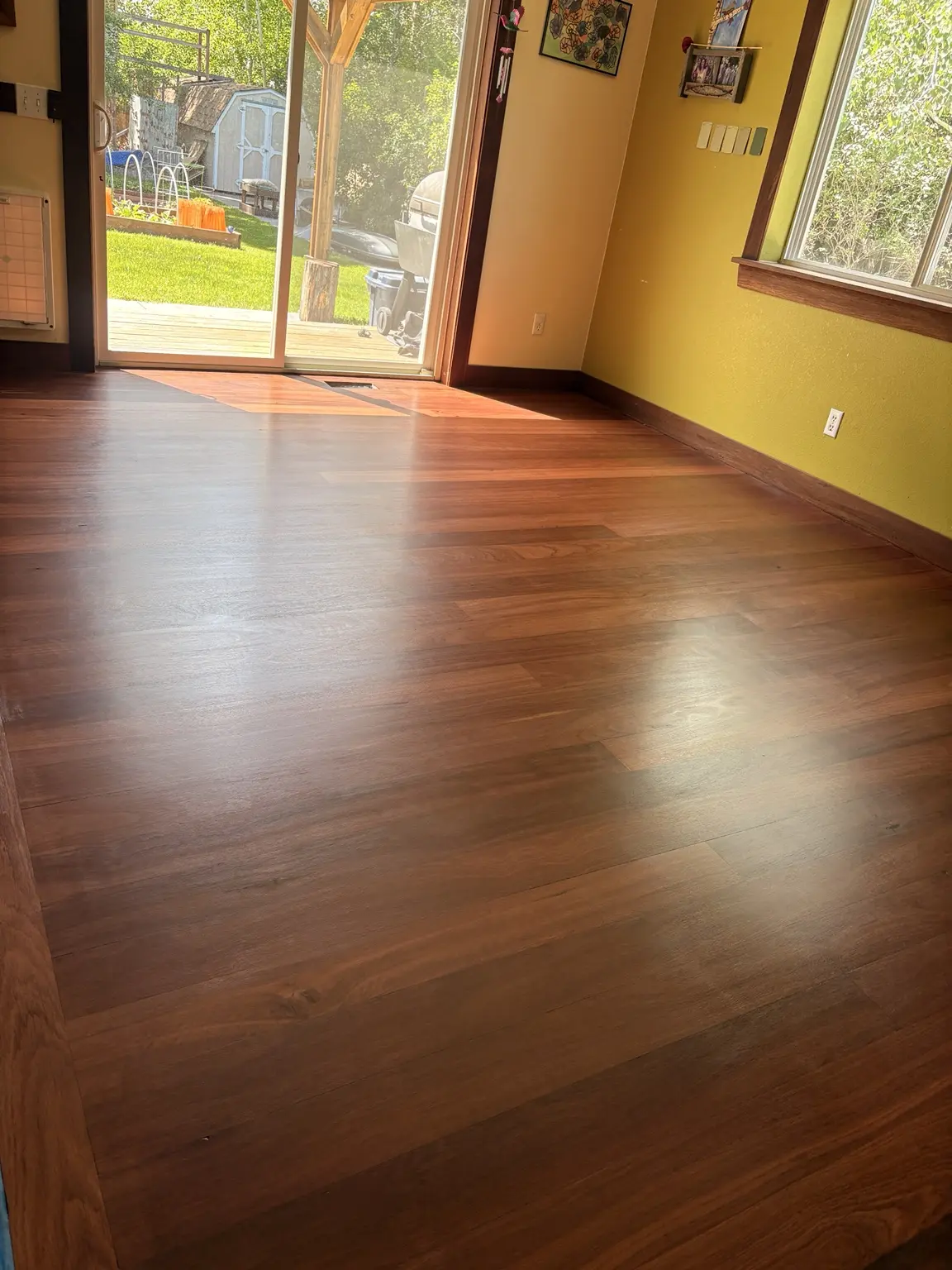 Rich stained hardwood floor with custom perimeter border