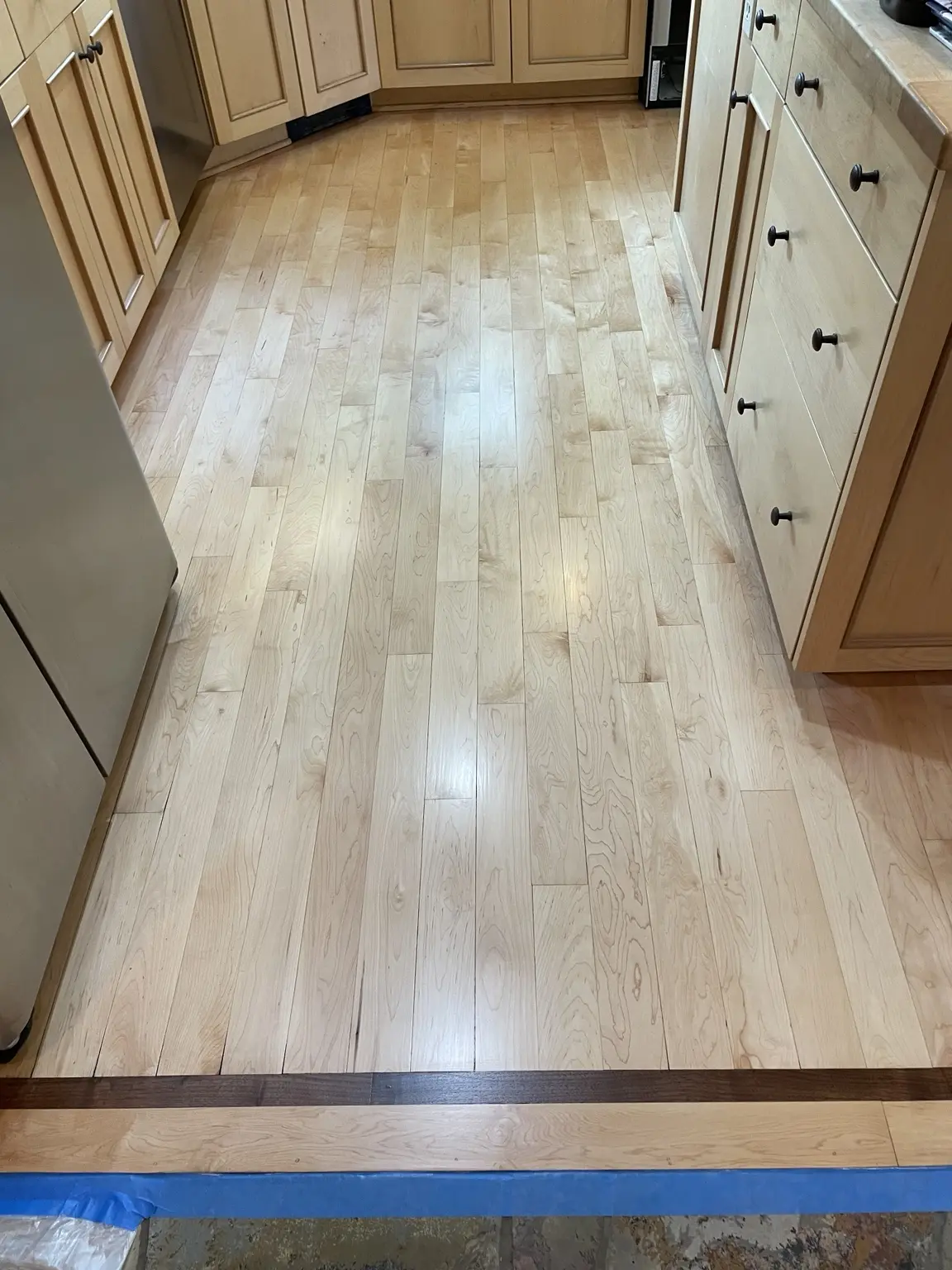 Natural maple hardwood kitchen floor with border detail
