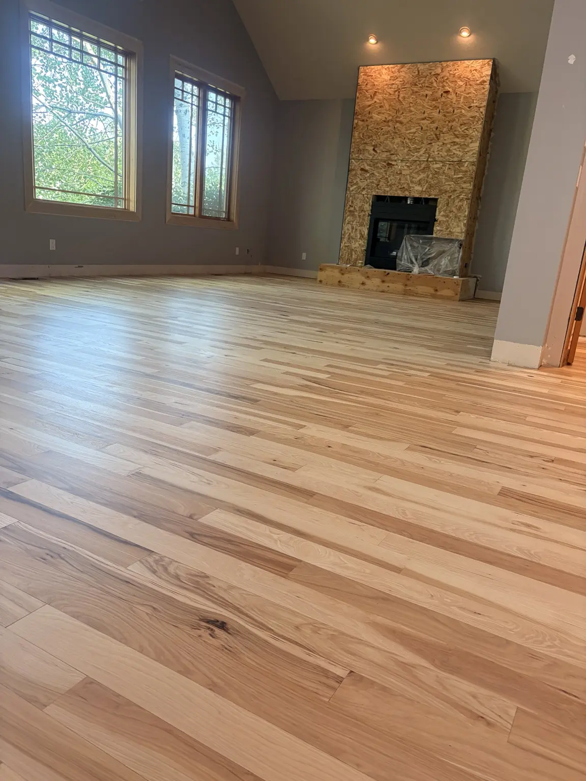 New natural hardwood floor across a Montana living room